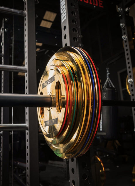 IRONSIDE colour-coded Olympic weight plates loaded on a barbell in a power rack - Olympic plates and bumper plates Canada